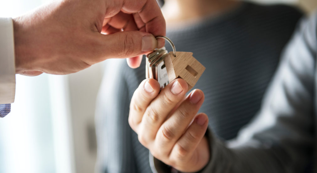 handing homeowners keys